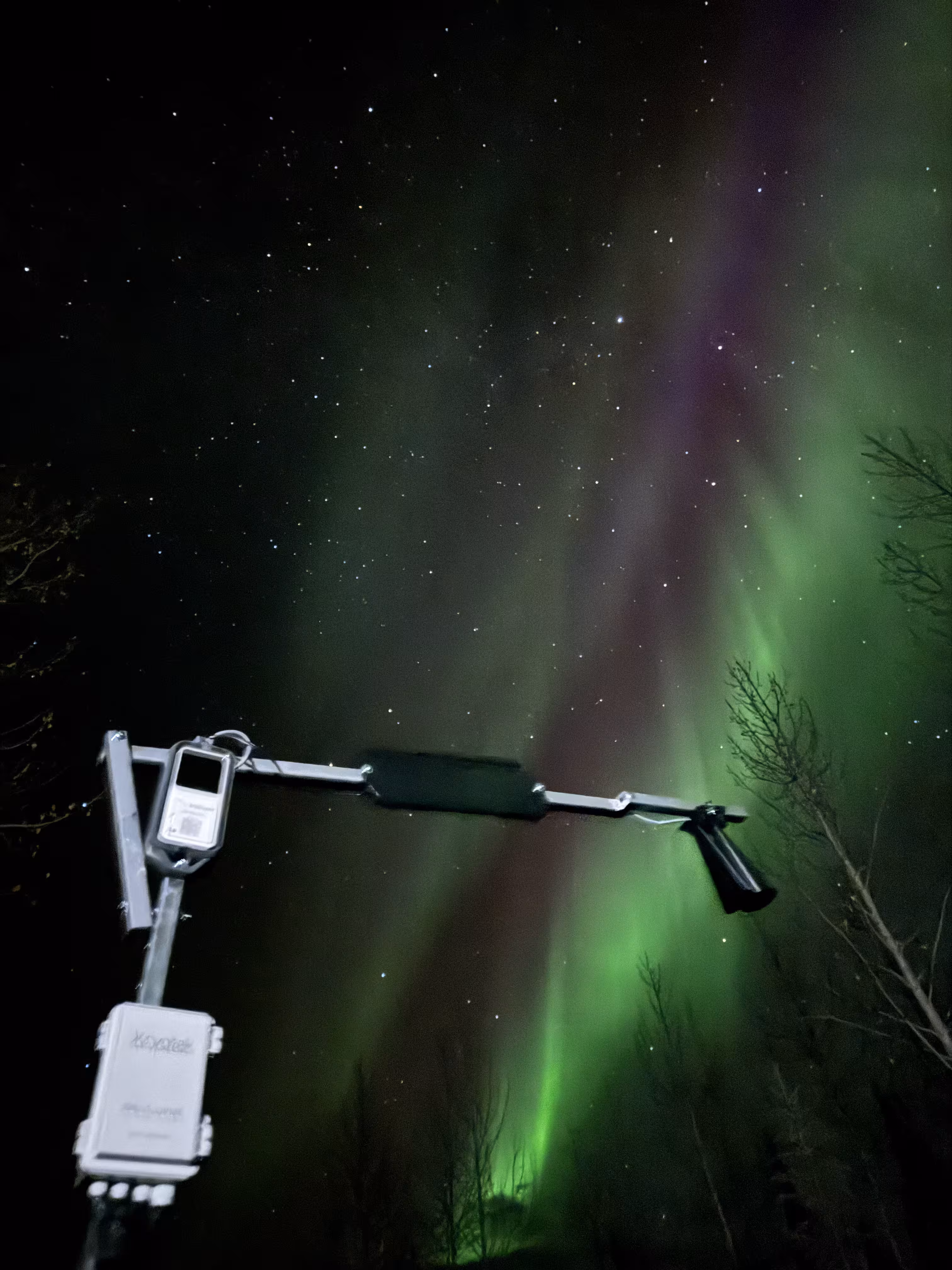 HARDWARIO CHESTER device under the northern lights in the Arctic