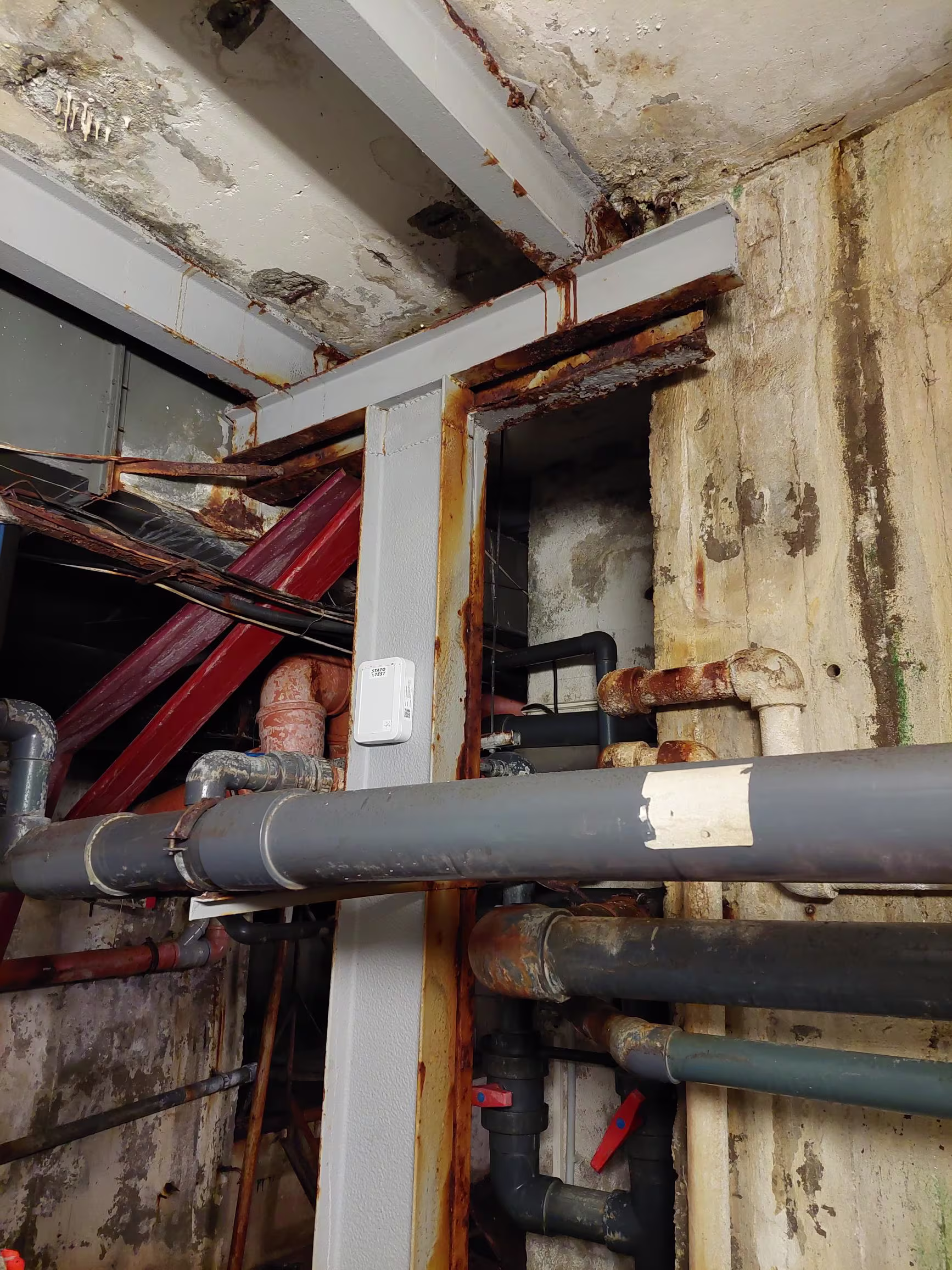 Close-up of crack monitoring sensors installed on concrete structure